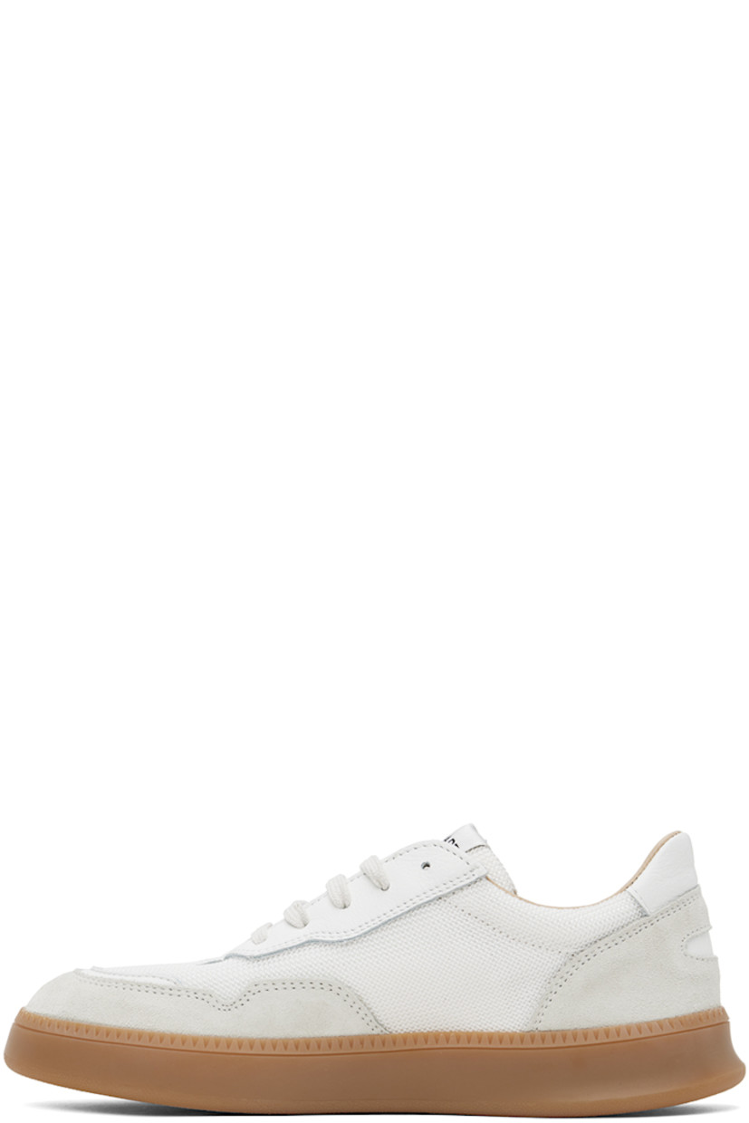 Low-top paneled canvas, nappa leather, and suede sneakers in off-white and gray.

· Lace-up closure
· Padded tongue and collar
· Serrated detailing at welt
· Mesh and buffed calfskin lining
· Treaded rubber sole

Supplier color: Off-white