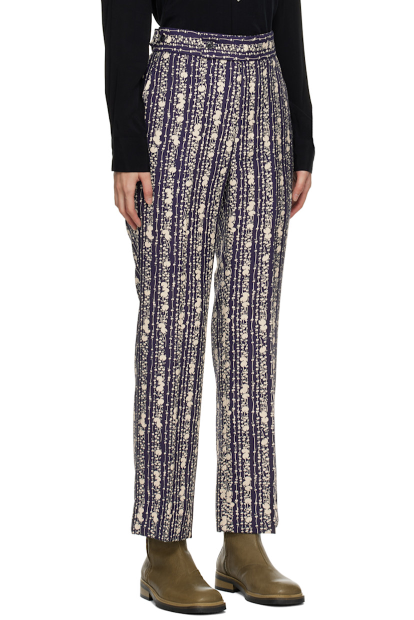 Polyester hopsack trousers. Graphic pattern printed throughout.

· Four-pocket styling
· Zip-fly
· Central creases at front and back
· Adjustable elasticized button tabs at back
· Darts at back

Supplier color: Dark navy