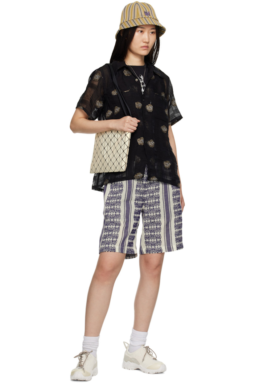 Cotton gobelin shorts. Metallic thread detailing and jacquard graphic pattern throughout.

· Concealed drawstring at elasticized hem
· Four-pocket styling
· Unlined

Supplier color: White