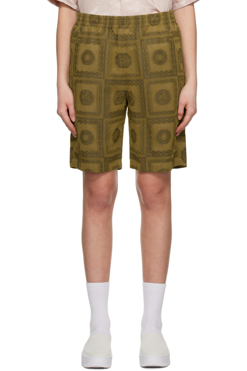 Plain-woven polyester-blend shorts. Jacquard graphic pattern throughout.

· Concealed drawstring at elasticized waistband
· Four-pocket styling
· Full cupro satin lining

Supplier color: Olive