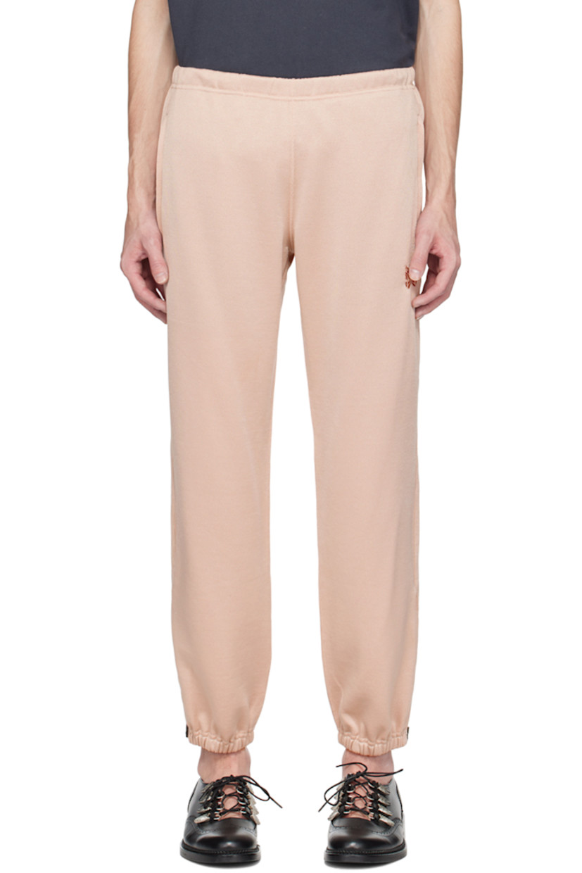 Polyester-blend French terry lounge pants.

· Concealed drawstring at elasticized waistband
· Two-pocket styling
· Logo graphic embroidered at front
· Zip vent at elasticized cuffs

Supplier color: Old rose