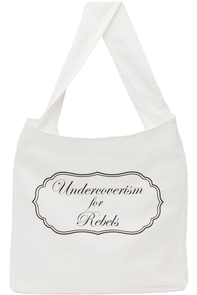 Cotton jersey messenger bag in white.

�· Fixed shoulder strap
· Logo and text printed at face
· Logo patch at back face
· Zip pocket at interior
· Broadcloth lining
· H16.5 x W18 x D3.25 in

Supplier color: Off-white