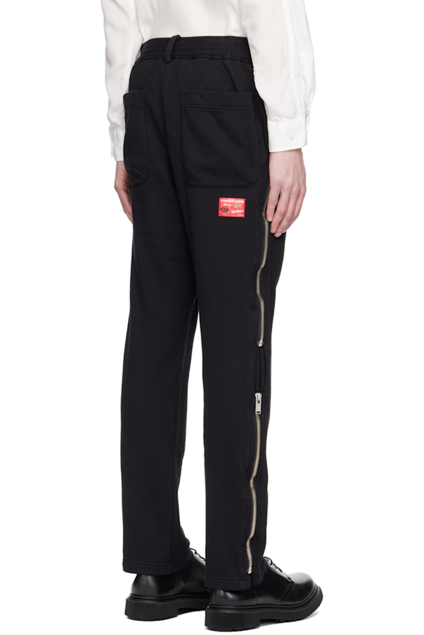 French terry trousers.

· D-ring at belt loops
· Concealed drawstring at elasticized waistband
· Four-pocket styling
· Zip accents at outseams 
· Logo patch at back 

Supplier color: Black
