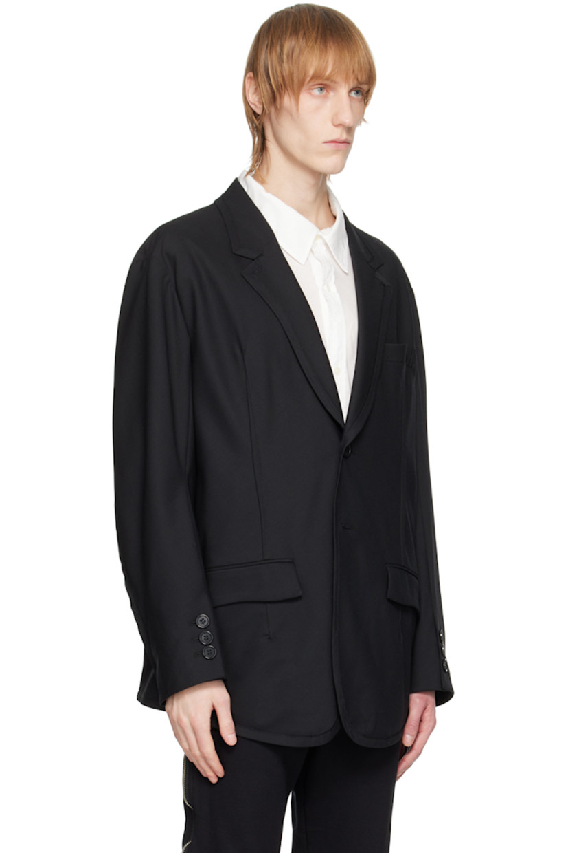 Wool-blend twill blazer. 

· Notched lapel
· Two-button closure
· Flap pockets
· Exposed darts at front
· Padded shoulders
· Three-button surgeon's cuffs 
· Partial cupro satin lining

Supplier color: Black