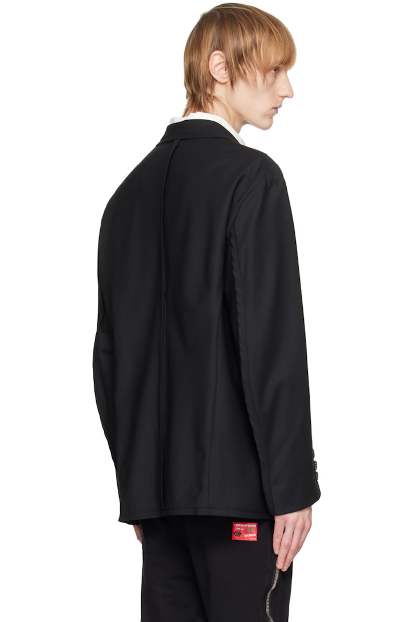 Wool-blend twill blazer. 

· Notched lapel
· Two-button closure
· Flap pockets
· Exposed darts at front
· Padded shoulders
· Three-button surgeon's cuffs 
· Partial cupro satin lining

Supplier color: Black