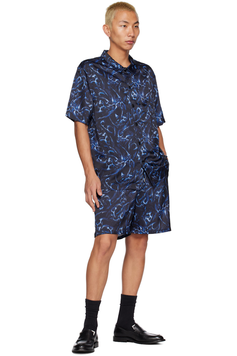Polyester satin shorts. Graphic pattern printed throughout. 

· Drawstring at elasticized waistband 
· Three-pocket styling 

Supplier color: Blue