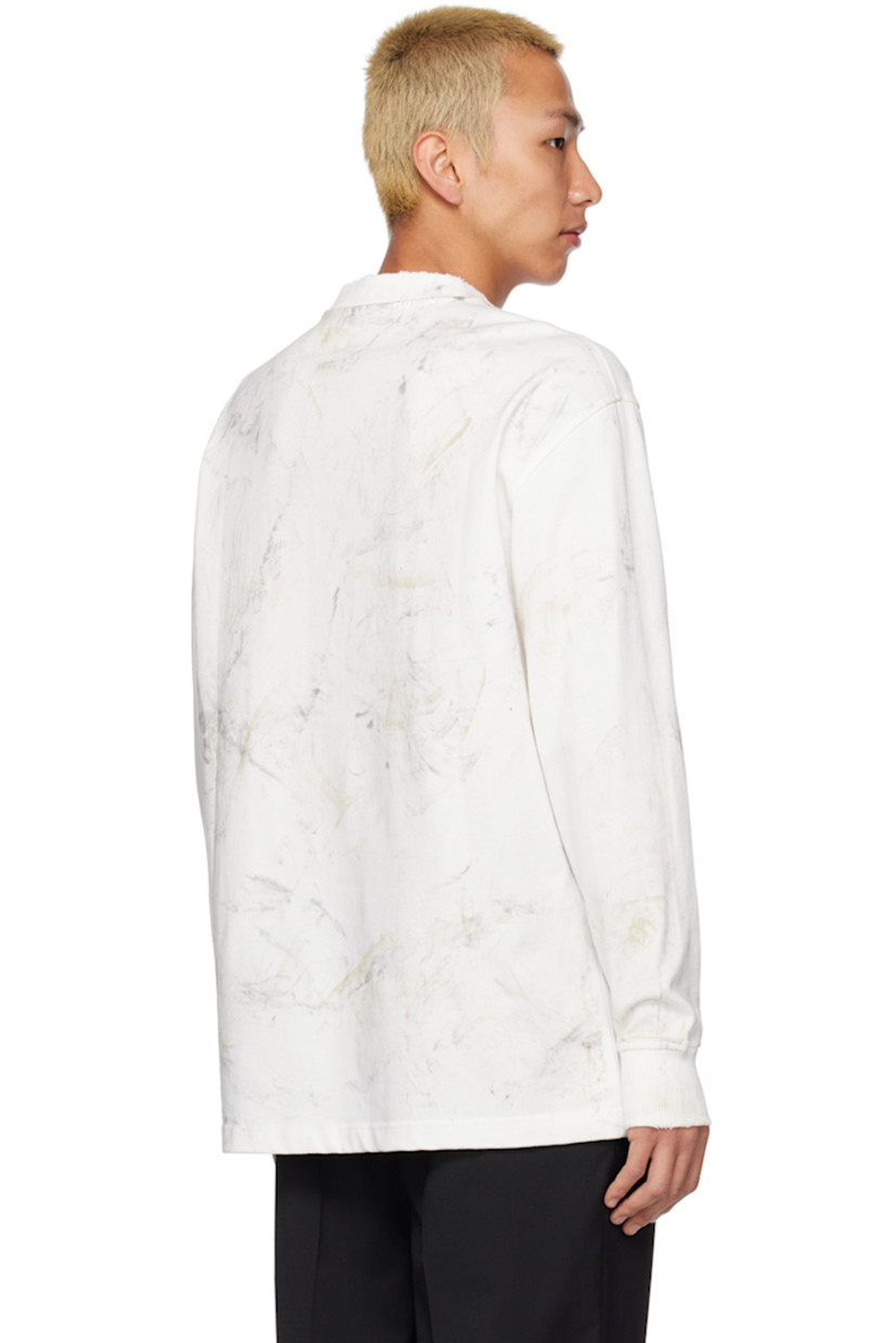 Knit cotton T-shirt. Distressing and pattern printed throughout. 

· Rib knit crewneck and cuffs
· Logo hardware at front 
· Dropped shoulders 

Supplier color: Dirty off-white