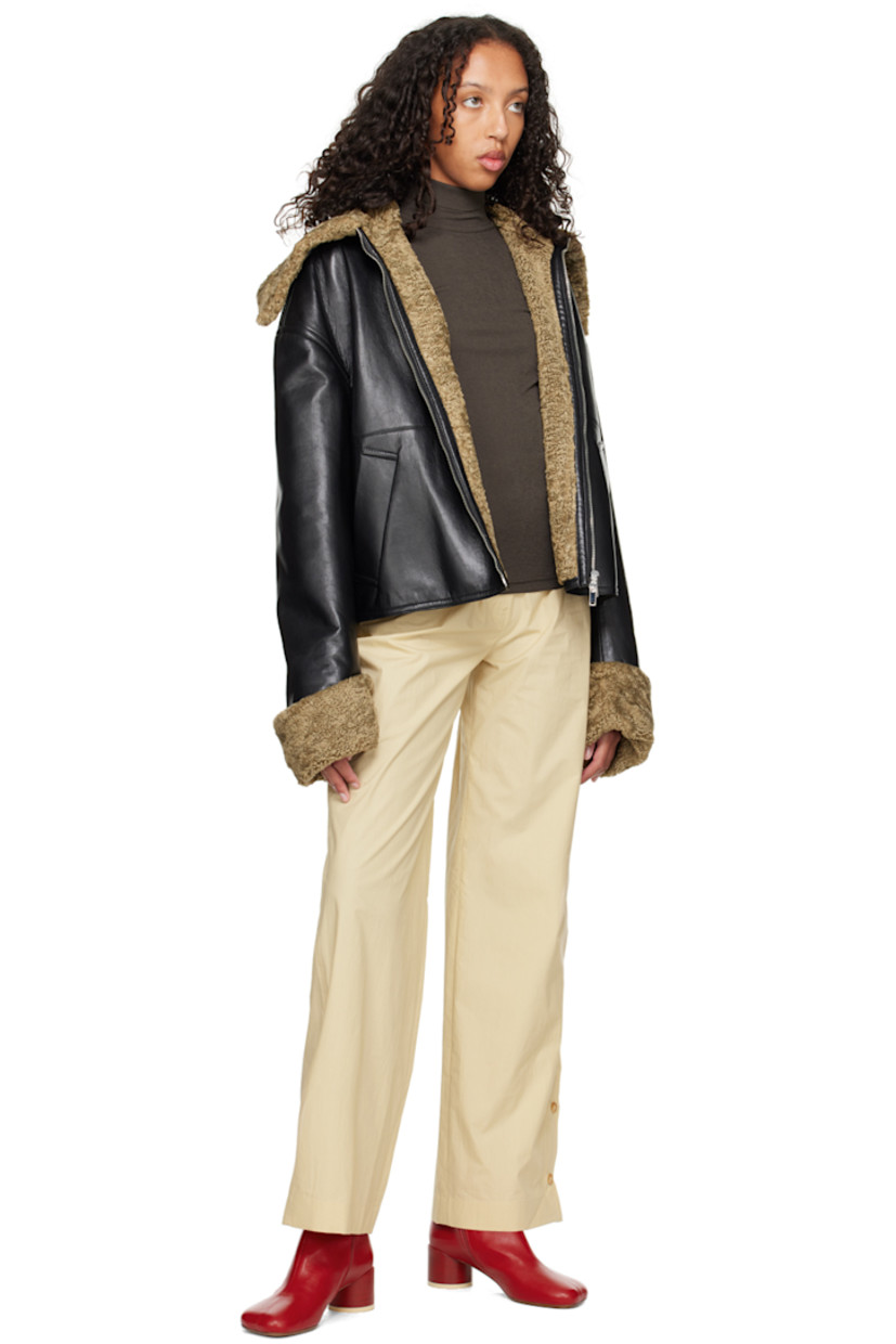 Straight-leg cotton poplin trousers.

· High-rise
· Belt loops
· Single-pocket styling
· Zip-fly
· Button detailing at side seam

Supplier color: Vintage creme