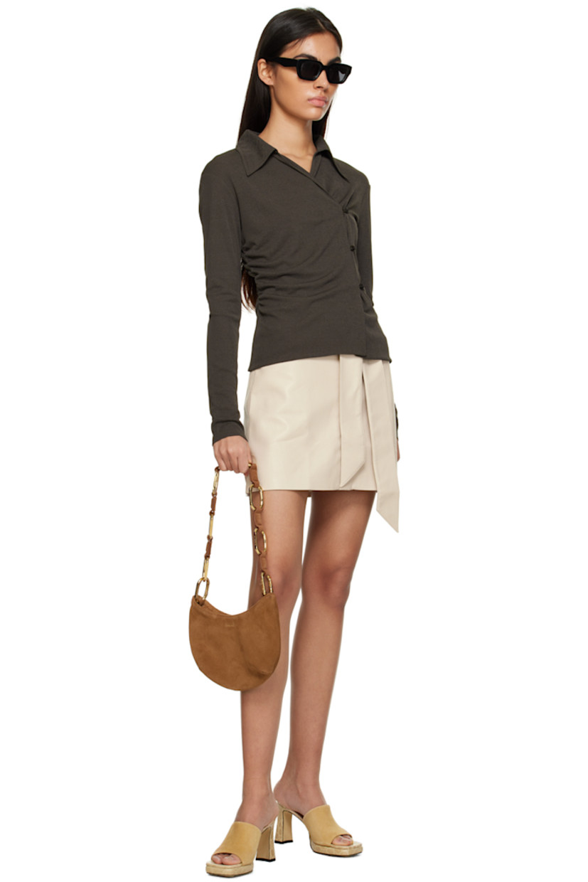Grained OKOBOR™ vegan leather skirt.

· Belt loops and detachable self-tie belt at waistband
· Four-pocket styling
· Button-fly
· Full crepe lining

Supplier color: Creme