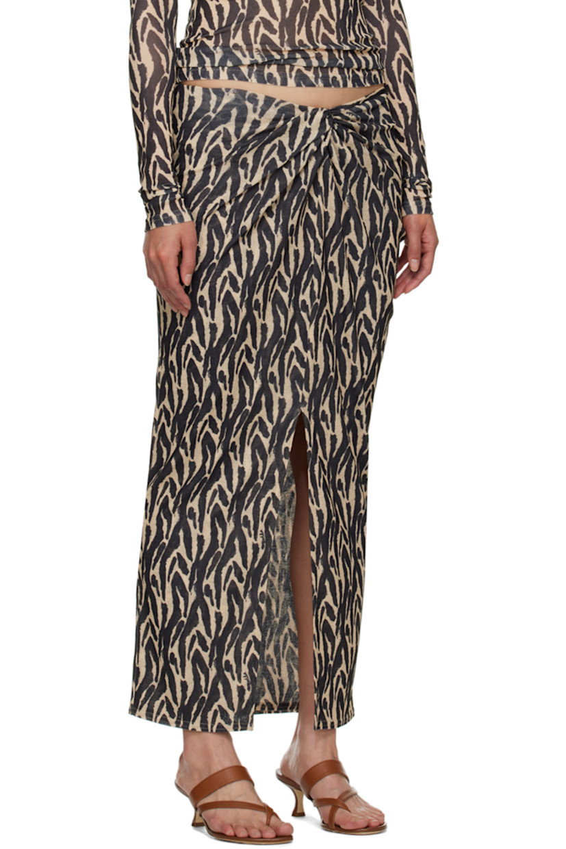 Semi-sheer recycled polyester skirt. Graphic pattern printed throughout.

· Layered construction
· Knotted detailing at elasticized waistband
· Central vent at front hem

Supplier color: Brushstroke animal