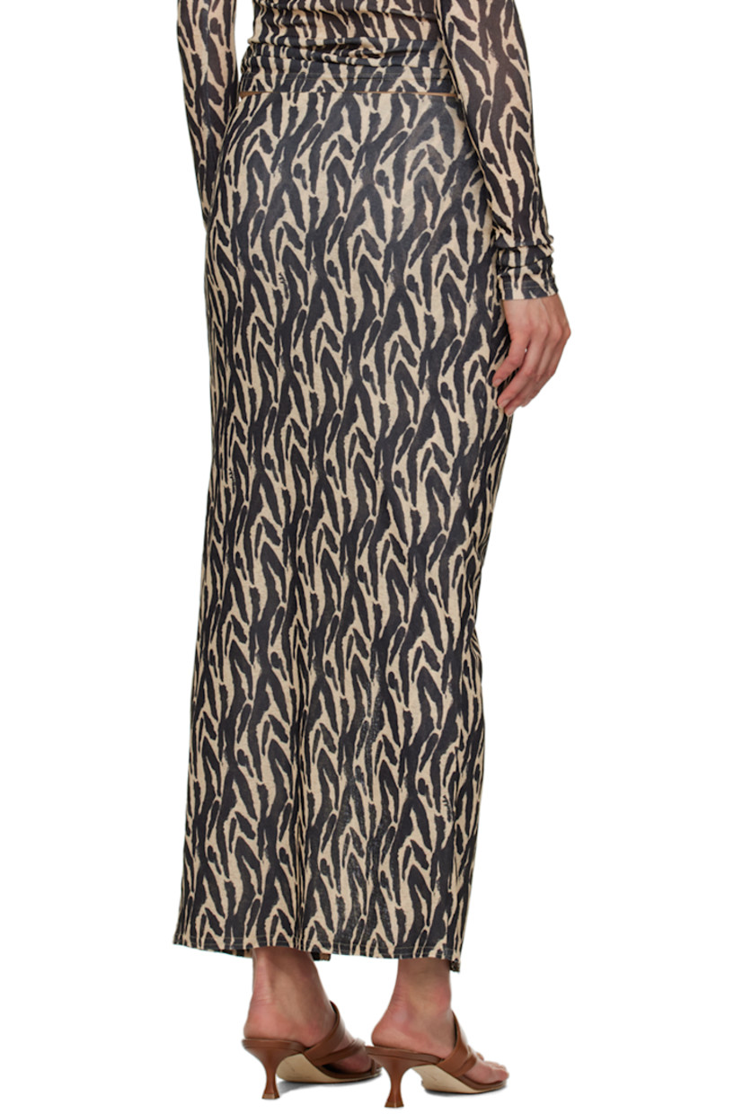 Semi-sheer recycled polyester skirt. Graphic pattern printed throughout.

· Layered construction
· Knotted detailing at elasticized waistband
· Central vent at front hem

Supplier color: Brushstroke animal