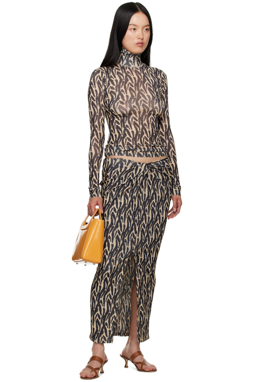 Semi-sheer recycled polyester skirt. Graphic pattern printed throughout.

· Layered construction
· Knotted detailing at elasticized waistband
· Central vent at front hem

Supplier color: Brushstroke animal