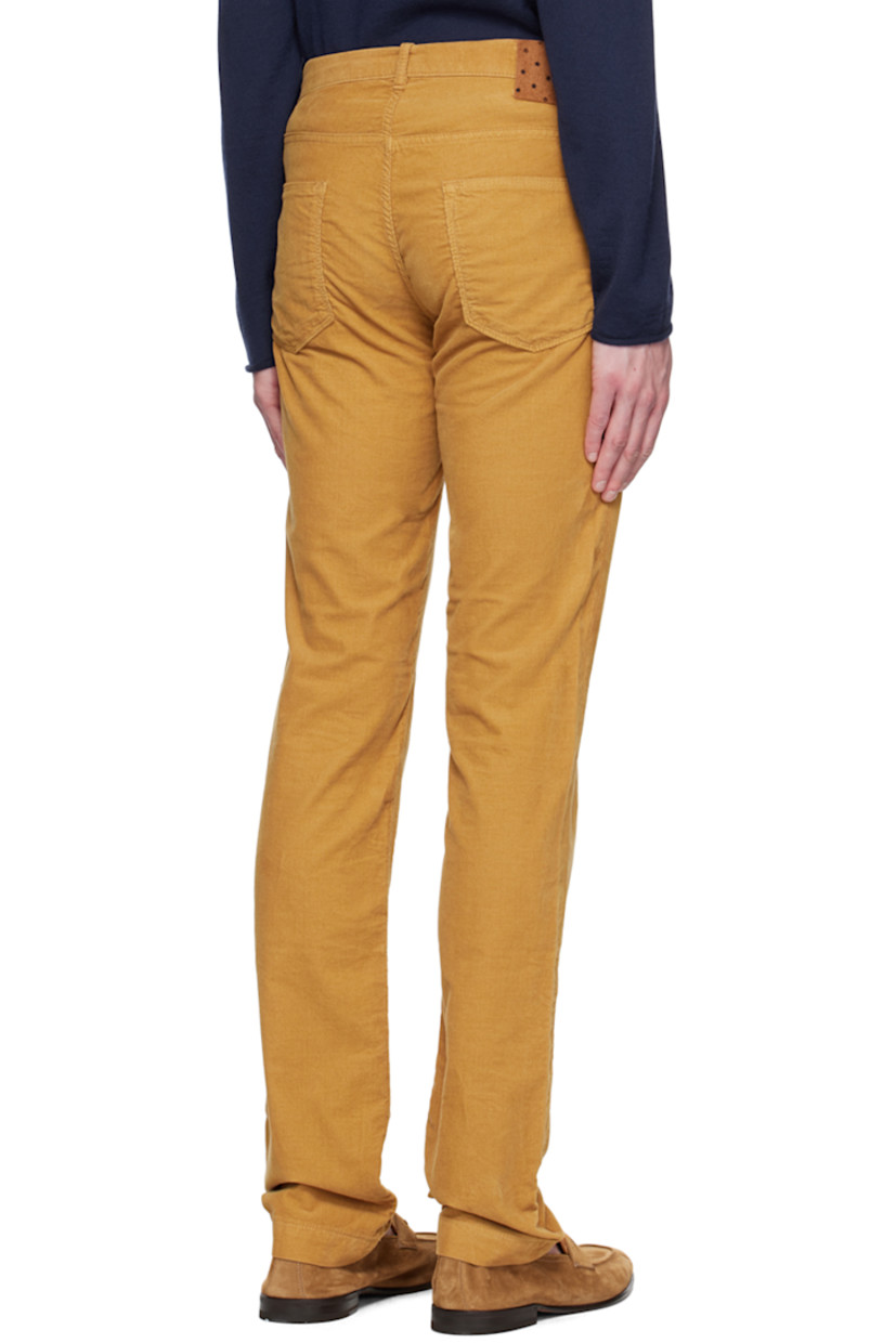 Cotton corduroy trousers. 

· Belt loops 
· Five-pocket styling 
· Button-fly 
· Leather logo patch at back waistband
· Cotton plain-woven pocket lining

Supplier color: Saffron
