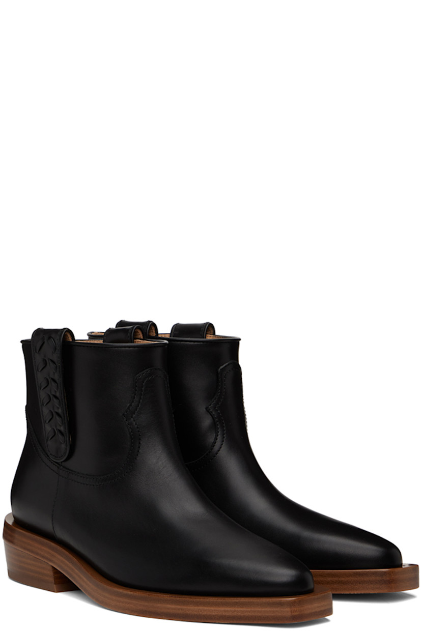 Ankle-high paneled buffed calfskin boots in black. 

· Almond toe
· Pull-loops with stitching at collar
· Grained calfskin lining
· Stacked leather block heel with rubber injection
· Leather sole
· Heel: H1 in

Supplier color: Black