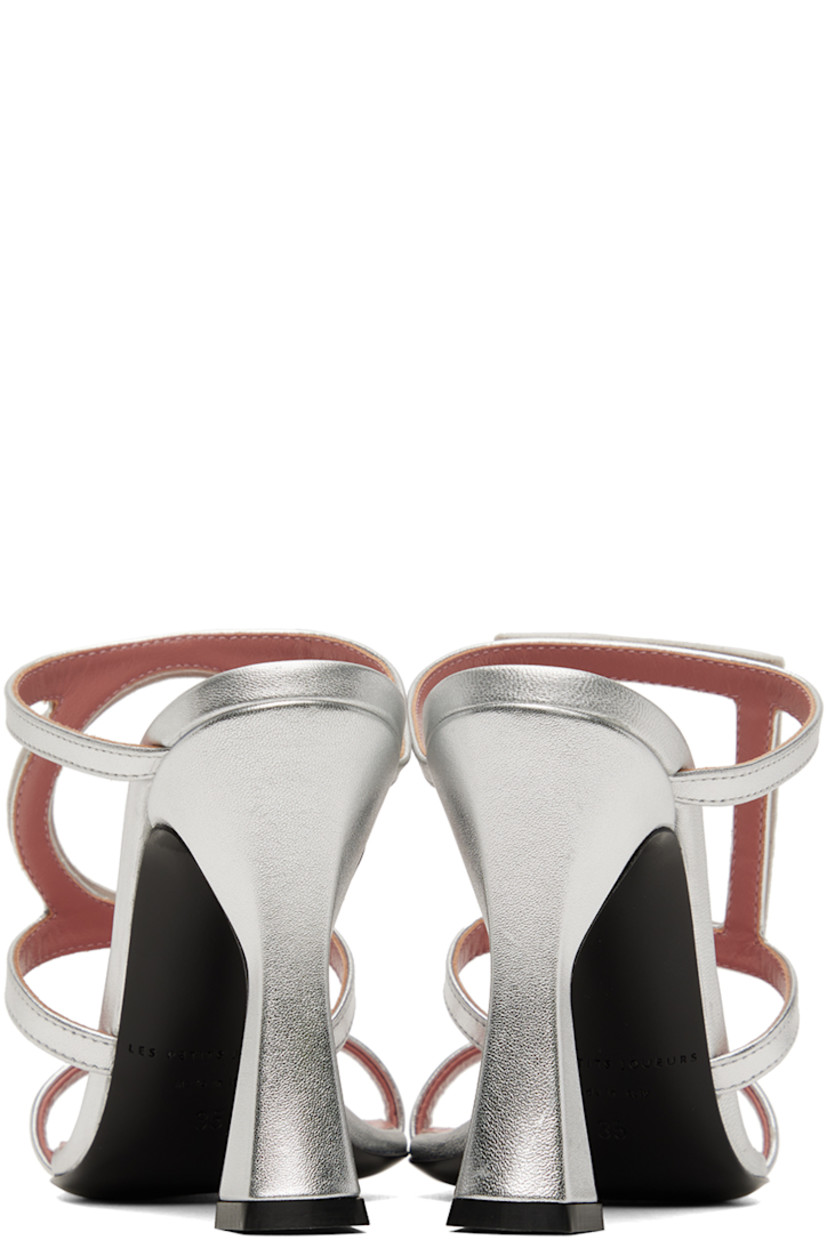 Grained nappa calfskin heeled sandals in silver.

· Open square toe
· Crystal-cut graphic appliqué at vamp
· Logo patch at padded footbed
· Covered heel with rubber injection 
· Leather outsole
· Heel: H3.75 in

Supplier color: Silver
