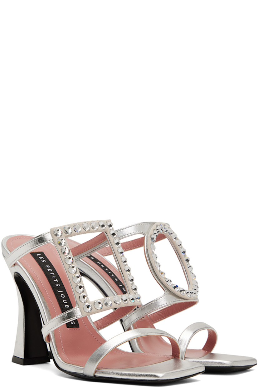 Grained nappa calfskin heeled sandals in silver.

· Open square toe
· Crystal-cut graphic appliqué at vamp
· Logo patch at padded footbed
· Covered heel with rubber injection 
· Leather outsole
· Heel: H3.75 in

Supplier color: Silver