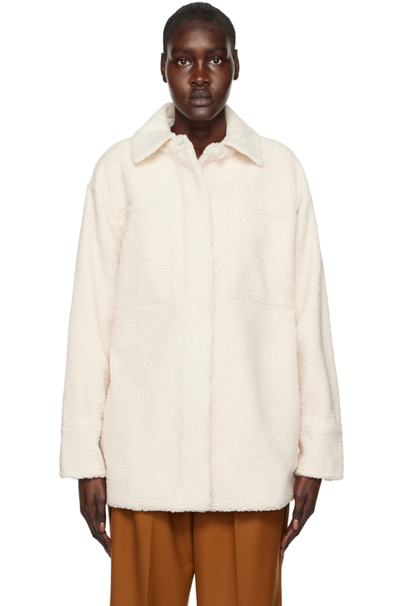 Polyester sherpa fleece jacket. 

· Spread collar 
· Concealed button closure 
· Welt pockets and seam pockets 
· Curved hem
· Single-button barrel cuffs 
· Full faux-suede lining 

Supplier color: Chiffon