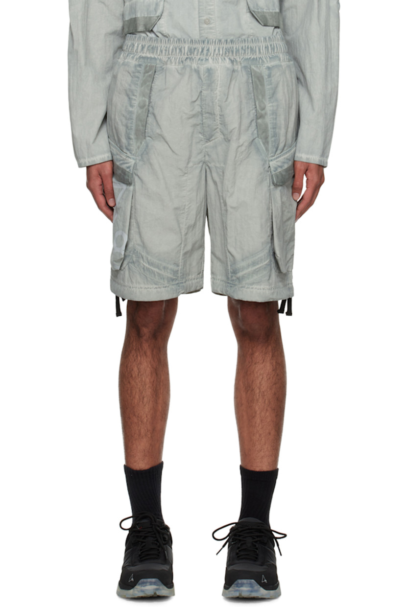 Crinkled garment-dyed nylon faille shorts. Smudging throughout. 

· Concealed drawstring at elasticized waistband
· Four-pocket styling
· Zip-fly
· Flap pocket at outseams
· Rubberized logo patch and logo printed at outseam
· Drawstring at cuffs

Supplier color: Bone
