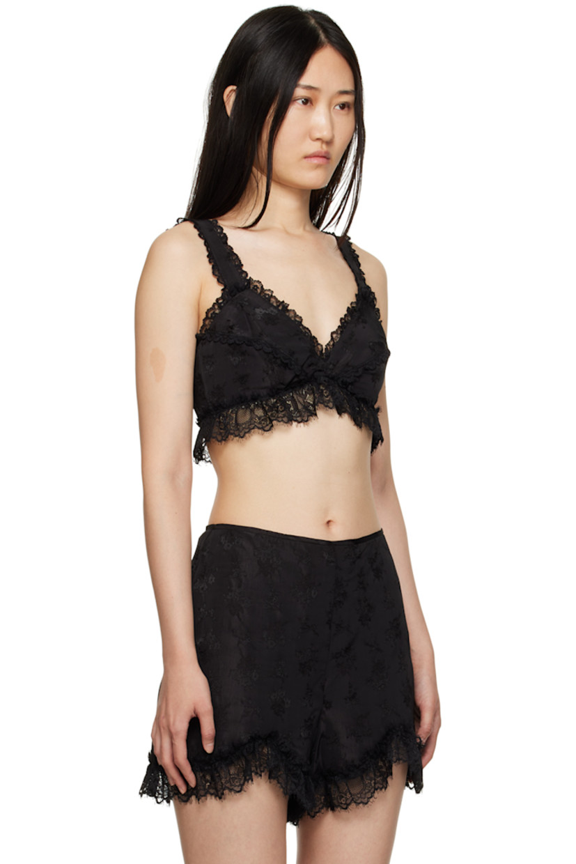 Plain-woven viscose and acetate-blend camisole. Jacquard floral pattern and lace ruffles throughout.

· Sweetheart neck
· Fixed shoulder straps
· Hook-eye fastening at back
· Full mesh lining

Supplier color: Black