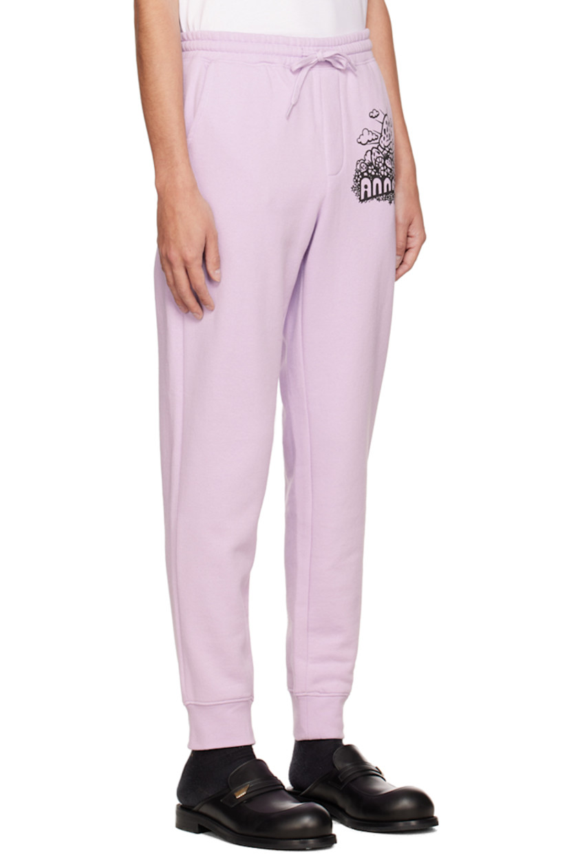 Cotton and polyester-blend fleece lounge pants. 

· Drawstring at elasticized waistband
· Three-pocket styling
· Mock-fly
· Logo graphic printed at front 
· Rib knit cuffs 

Available exclusively at SSENSE.

Supplier color: Lavender/Multi