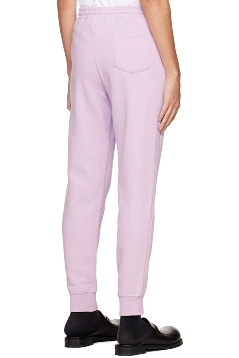 Cotton and polyester-blend fleece lounge pants. 

· Drawstring at elasticized waistband
· Three-pocket styling
· Mock-fly
· Logo graphic printed at front 
· Rib knit cuffs 

Available exclusively at SSENSE.

Supplier color: Lavender/Multi