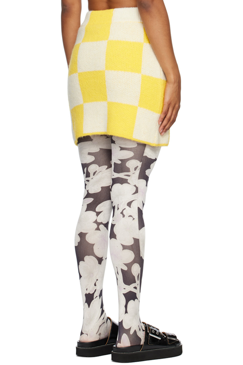 Knit acrylic- and alpaca-blend skirt. Check pattern throughout.

· High-rise
· Rib knit waistband
· Mock button closure
· Crystal-cut hardware

Supplier color: Sunrise check
