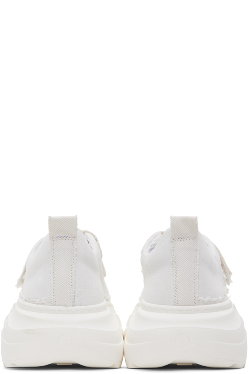 Low-top paneled faux-suede, canvas, and twill sneakers in white. 

· Velcro closure
· Padded tongue and collar
· Pull-loop at heel collar
· Mesh lining
· Logo embossed at rubber platform midsole
· Treaded rubber outsole
· Platform: H2.25 in

Supplier color: White