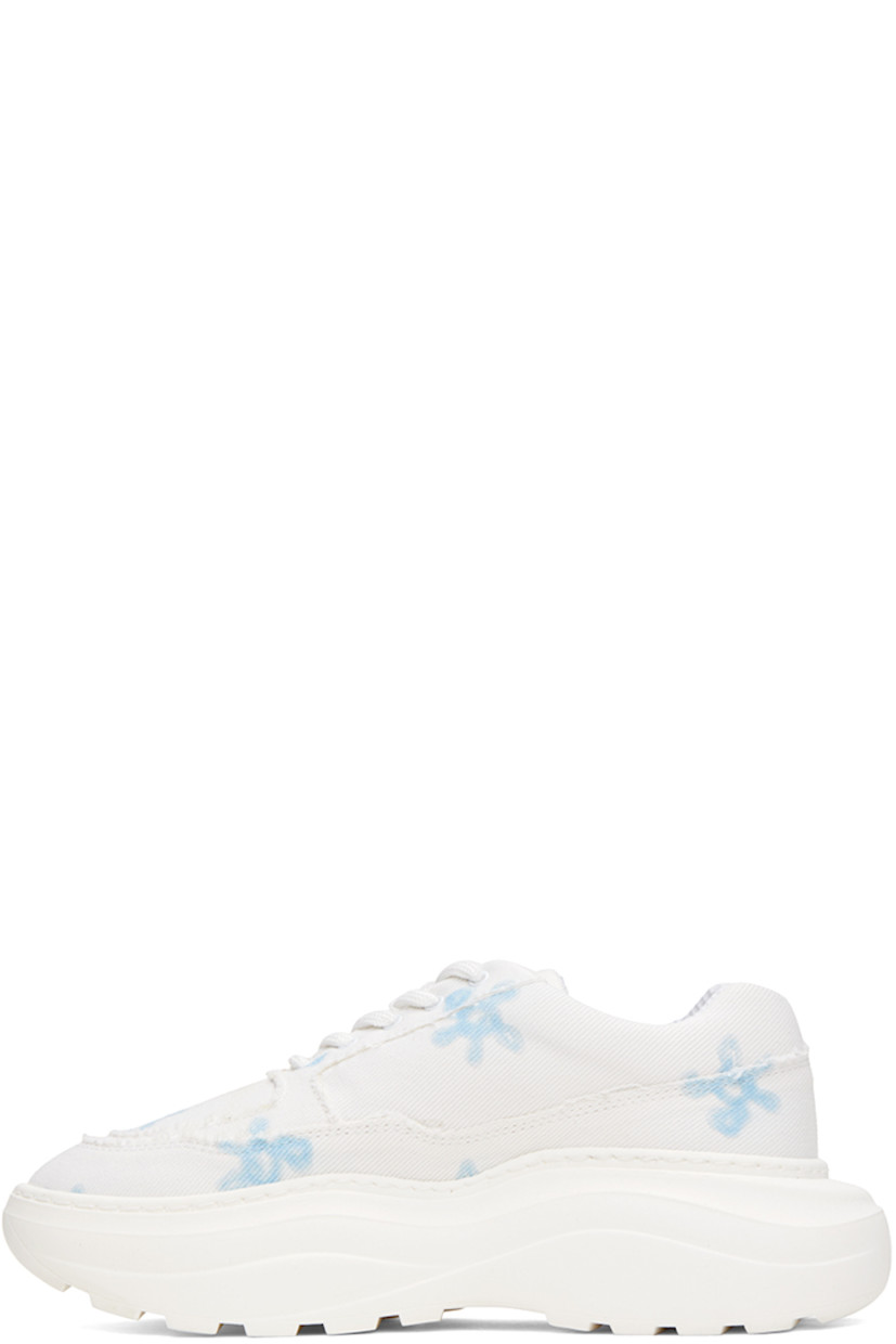 Low-top canvas sneakers in white. Raw edges and floral pattern printed throughout.

· Lace-up closure
· Padded tongue and collar 
· Logo embroidered at outer side
· Mesh lining
· Logo embossed at platform rubber midsole
· Treaded recycled rubber outsole
· Platform: H2 in 

Supplier color: Blue flower white