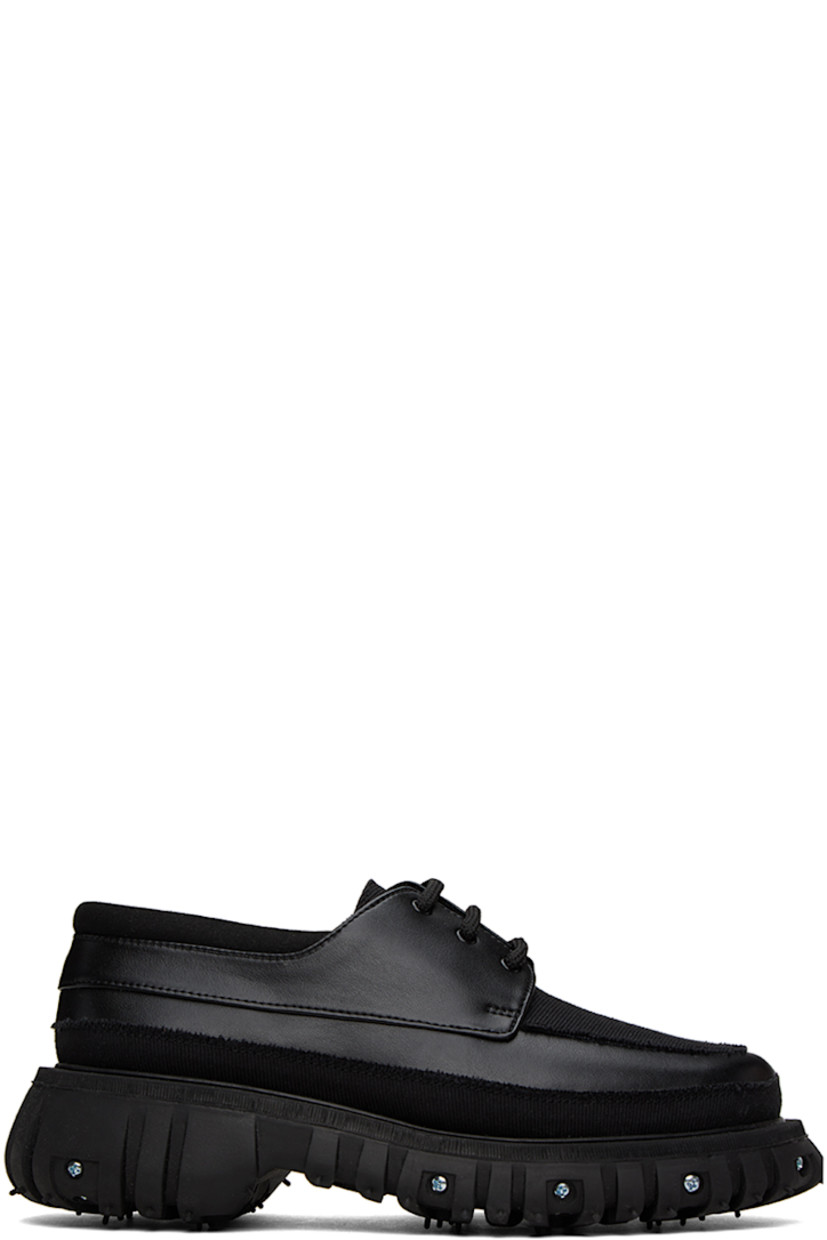 Buffed Apple Skin® faux-leather, faux-suede and canvas derbys in black. Raw edges throughout. 

· Moc toe
· Lace-up closure
· Padded collar
· Mesh lining
· Graphic hardware at rubber midsole
· Treaded recycled rubber outsole
· Silver-tone hardware

Supplier color: Black