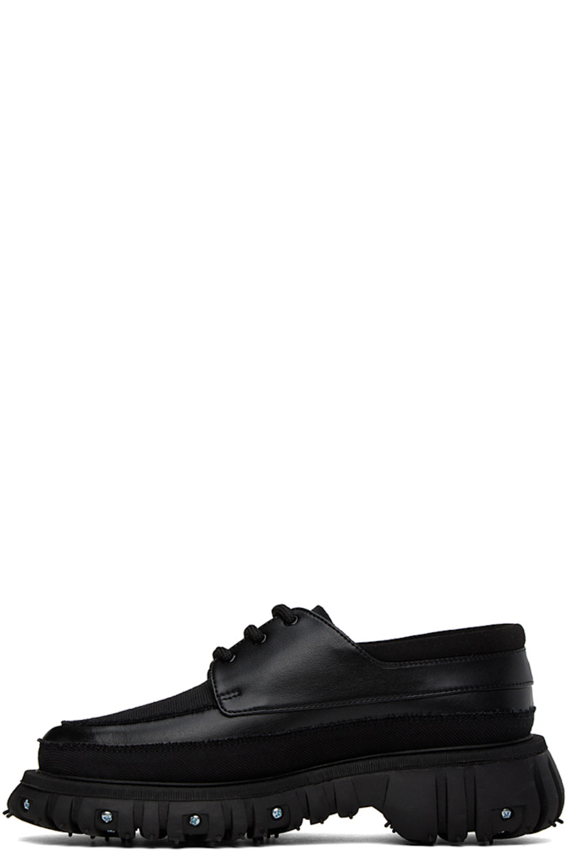 Buffed Apple Skin® faux-leather, faux-suede and canvas derbys in black. Raw edges throughout. 

· Moc toe
· Lace-up closure
· Padded collar
· Mesh lining
· Graphic hardware at rubber midsole
· Treaded recycled rubber outsole
· Silver-tone hardware

Supplier color: Black