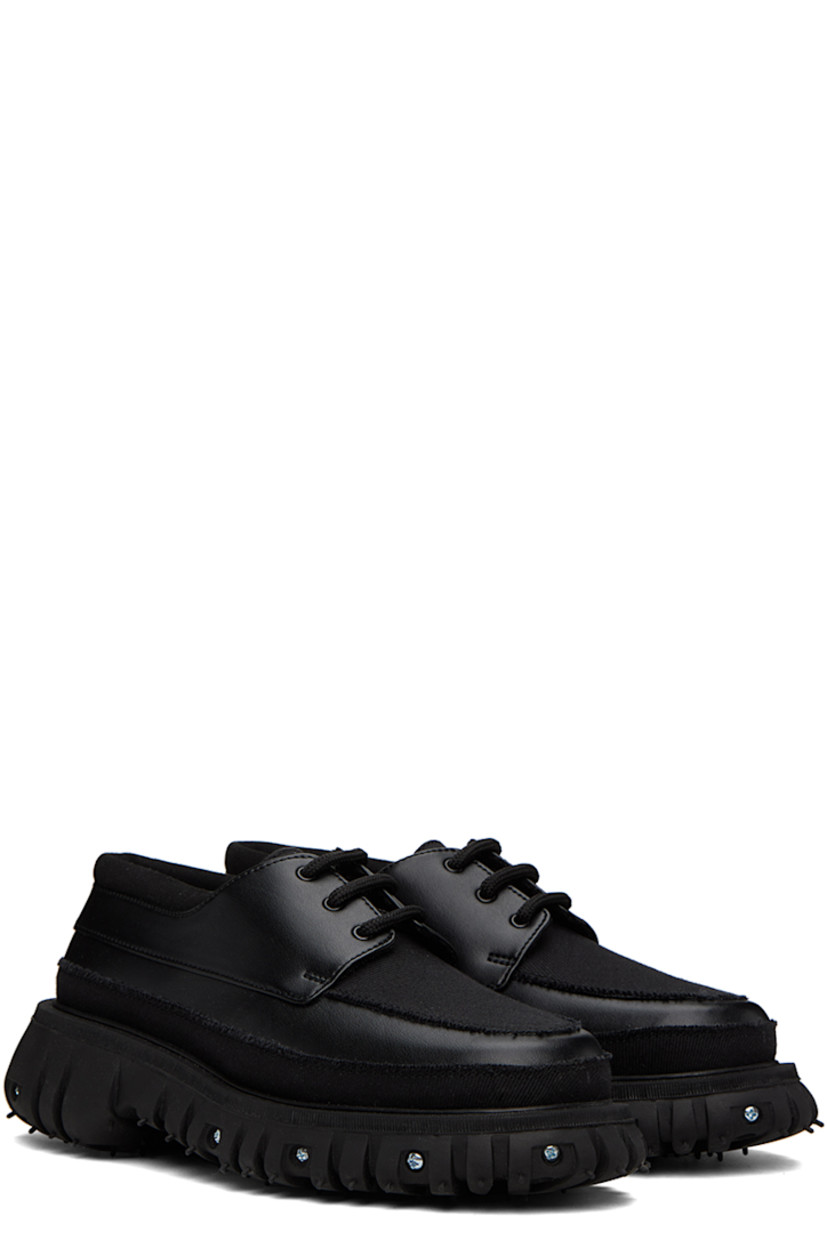 Buffed Apple Skin® faux-leather, faux-suede and canvas derbys in black. Raw edges throughout. 

· Moc toe
· Lace-up closure
· Padded collar
· Mesh lining
· Graphic hardware at rubber midsole
· Treaded recycled rubber outsole
· Silver-tone hardware

Supplier color: Black