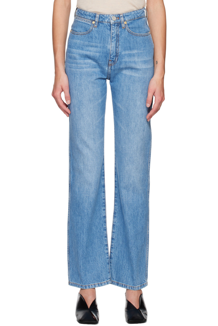 Straight-leg non-stretch denim jeans. Fading and whiskering throughout. 

· High-rise
· Belt loops
· Five-pocket styling
· Zip-fly
· Leather logo patch at back waistband
· Contrast stitching in tan

Supplier color: Indigo wash