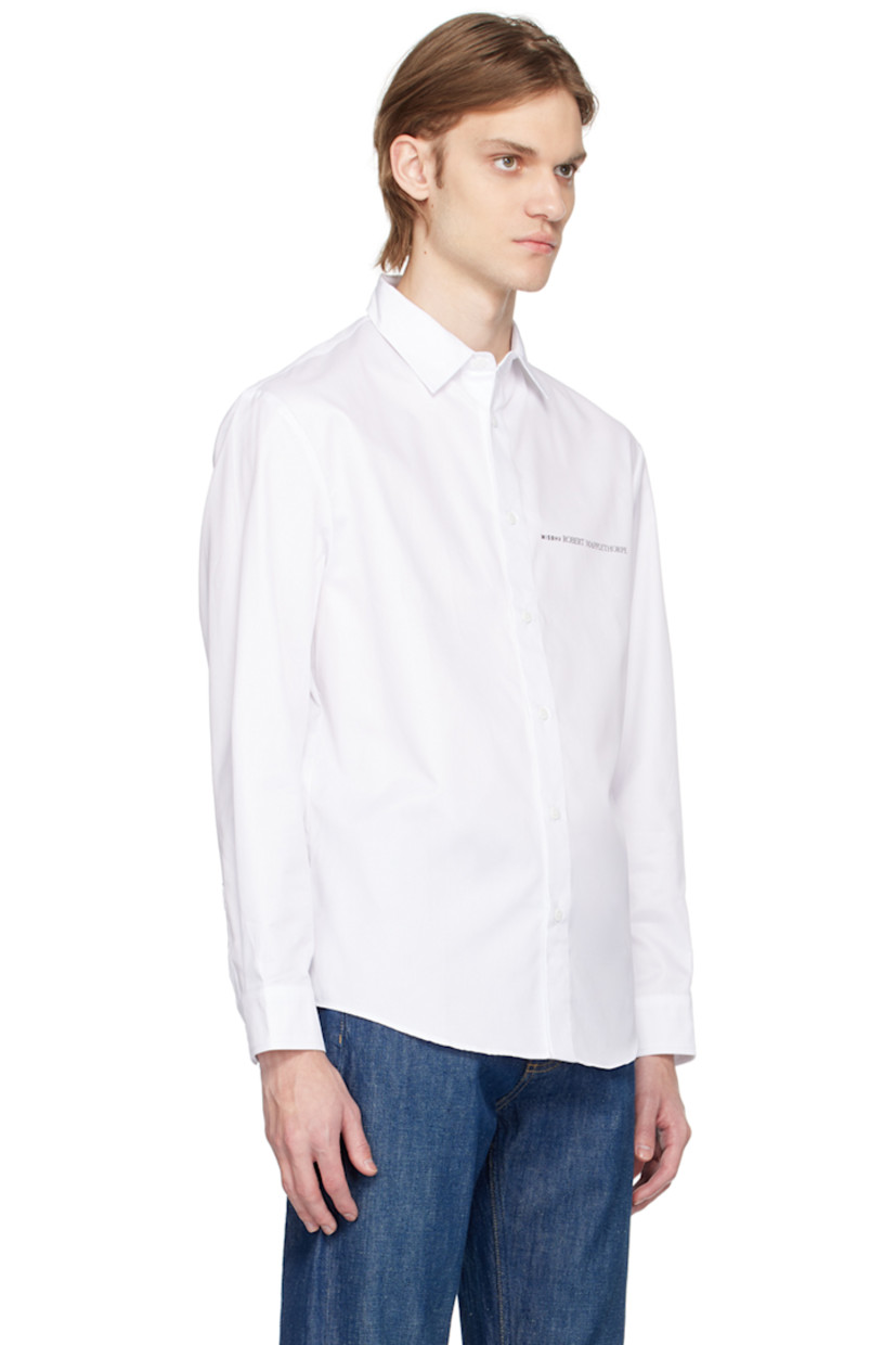 Cotton twill shirt. 

· Spread collar 
· Button closure 
· Logo printed at chest 
· Single-button barrel cuffs 
· Graphic printed at back 

Featuring artwork by Robert Mapplethorpe.

Supplier color: White