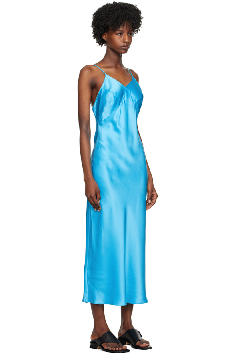Paneled silk charmeuse dress.

· V-neck
· Darts at chest
· Adjustable spaghetti straps
· Low back

Supplier color: Azure