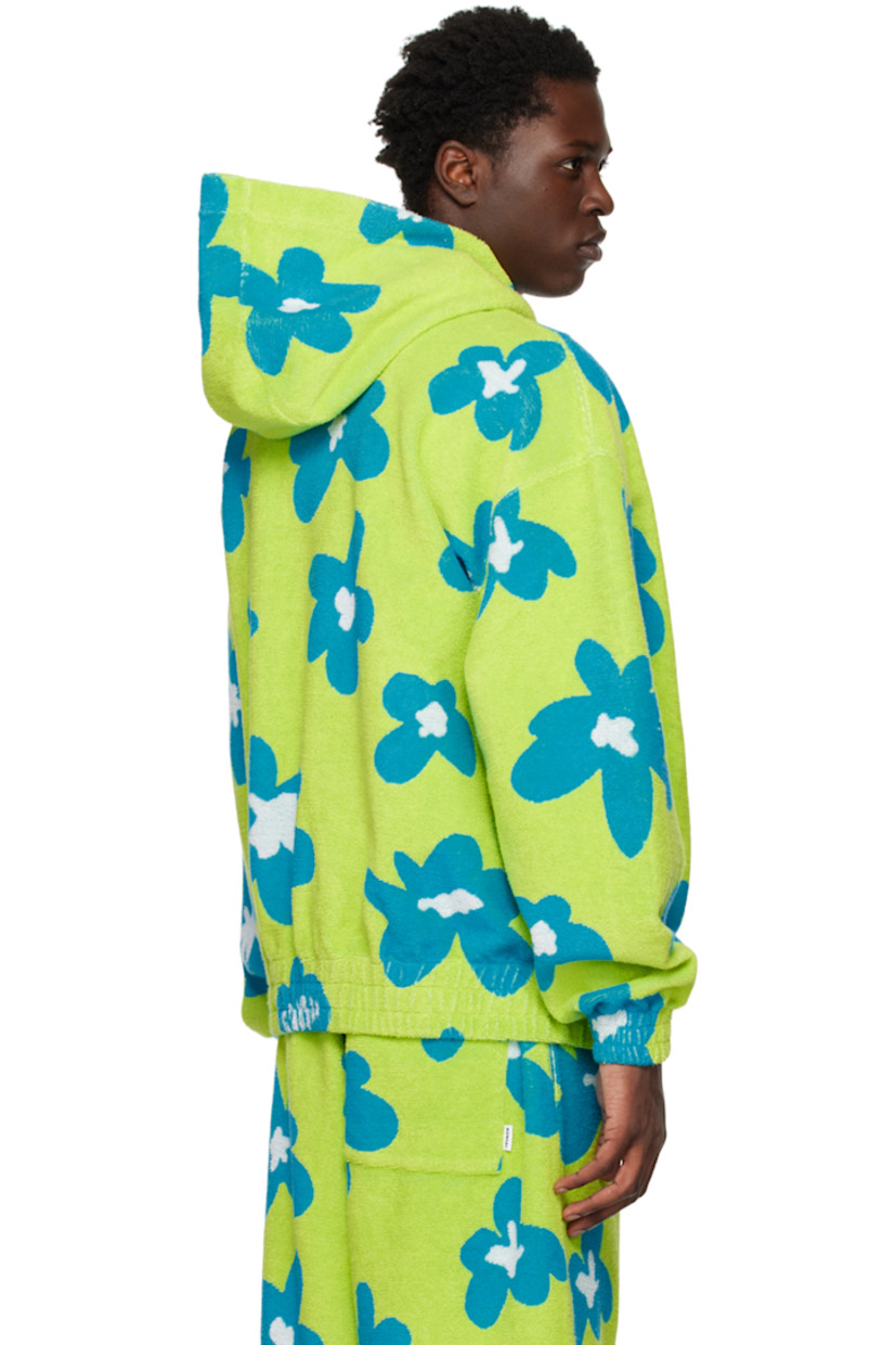 Reverse French terry hoodie. Jacquard graphic throughout. 

· Seam pockets  
· Elasticized hem and cuffs 

Supplier color: Acid green/Azure