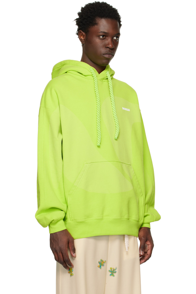 French terry hoodie. 

· Drawstring at hood 
· Logo printed at chest 
· Kangaroo pocket 
· Concealed bungee-style drawstring at rib knit hem
· Rib knit cuffs 

Supplier color: Acid green