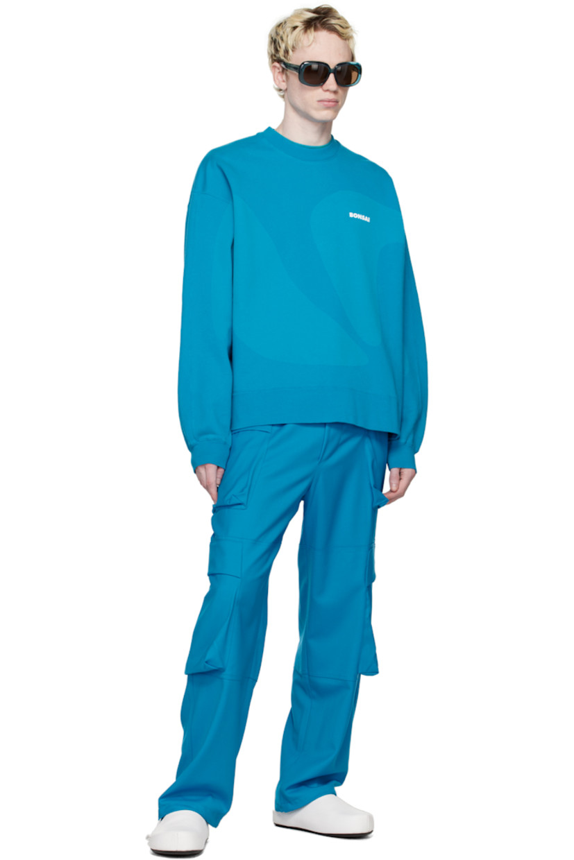 French terry sweatshirt. Graphic printed throughout.

· Rib knit crewneck, hem, and cuffs
· Logo printed at chest
· Dropped shoulders

Supplier color: Azure