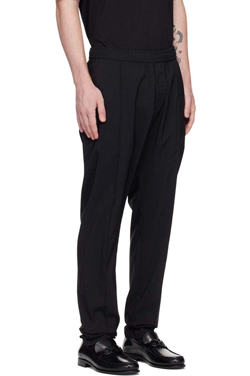 Virgin wool-blend ripstop trousers.

· Concealed drawstring at elasticized waistband
· Three-pocket styling
· Zip-fly
· Pinched seams at front

Supplier color: Nero