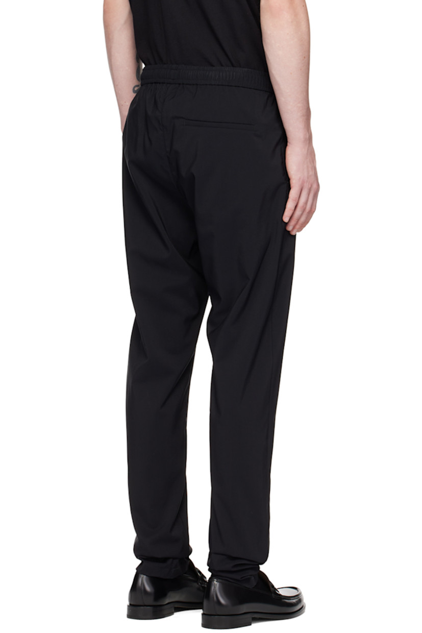 Virgin wool-blend ripstop trousers.

· Concealed drawstring at elasticized waistband
· Three-pocket styling
· Zip-fly
· Pinched seams at front

Supplier color: Nero