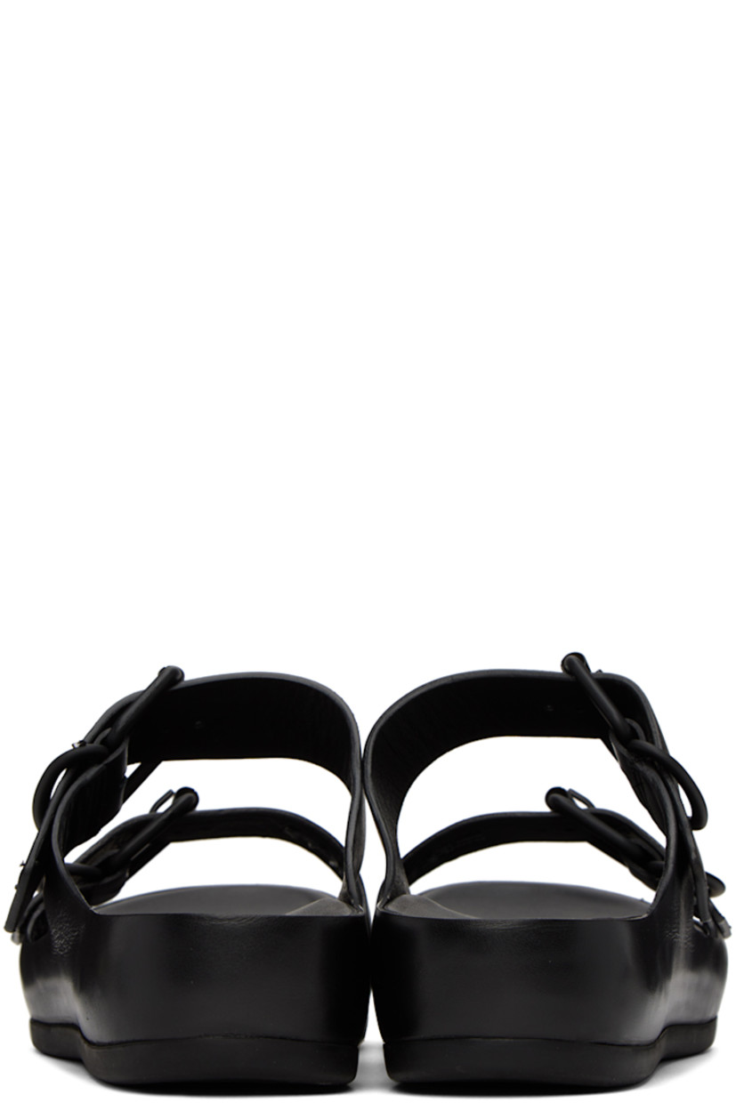 Grained calfskin flat sandals in black. 

· Open round toe
· Adjustable pin-buckle straps at vamp
· Logo embossed at leather footbed
· Covered leather platform midsole
· Treaded rubber outsole
· Platform: H1.5 in 

Part of the ECCO.kollektive x Natacha Ramsay Levi collaboration. 

Supplier color: Black
