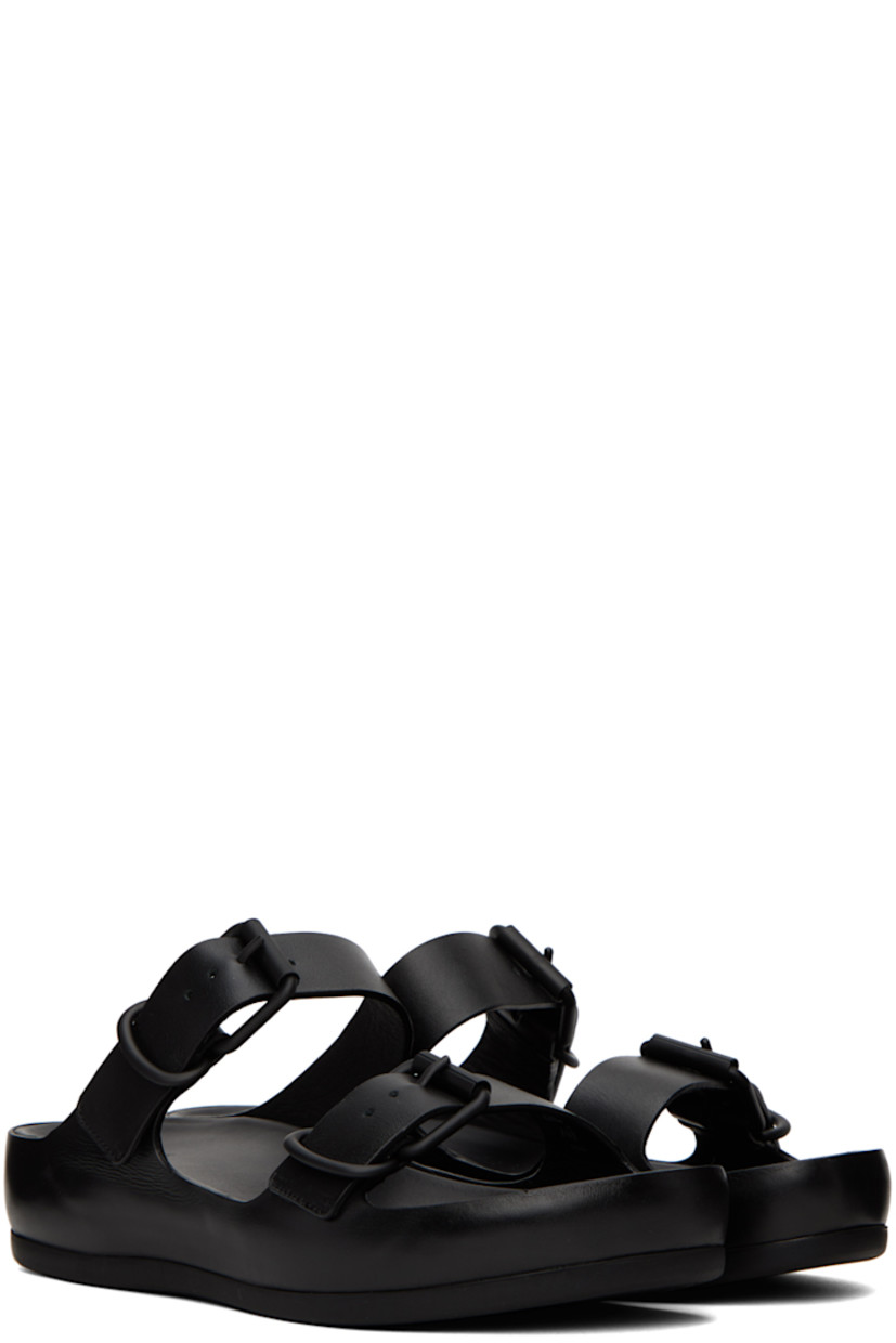 Grained calfskin flat sandals in black. 

· Open round toe
· Adjustable pin-buckle straps at vamp
· Logo embossed at leather footbed
· Covered leather platform midsole
· Treaded rubber outsole
· Platform: H1.5 in 

Part of the ECCO.kollektive x Natacha Ramsay Levi collaboration. 

Supplier color: Black