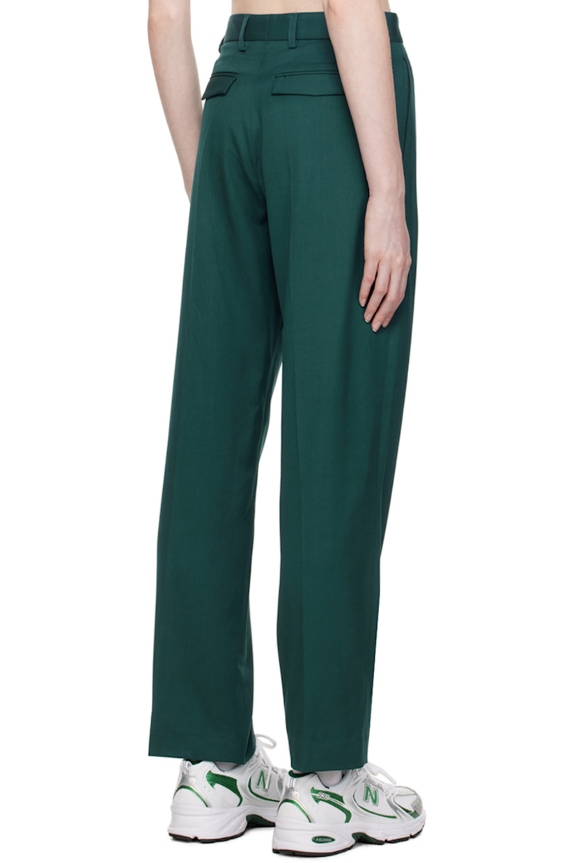 Merino wool delaine trousers. 

· Belt loops 
· Four-pocket styling 
· Zip-fly 
· Creased legs 

Supplier color: Green