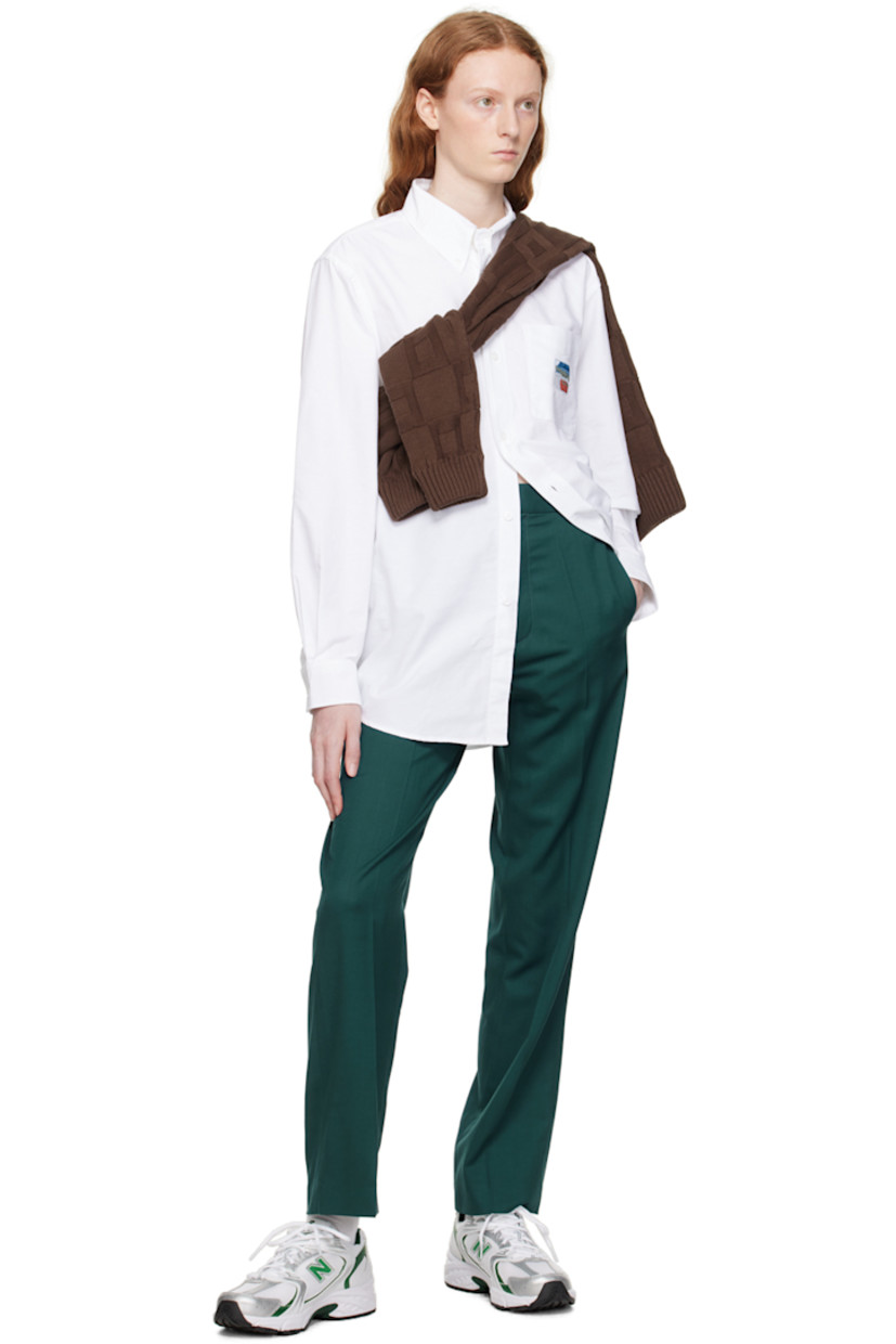 Merino wool delaine trousers. 

· Belt loops 
· Four-pocket styling 
· Zip-fly 
· Creased legs 

Supplier color: Green