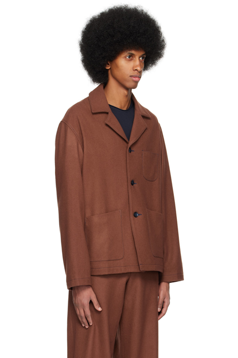 Merino wool melton jacket.

· Notched lapel
· Button closure
· Patch pockets at front
· Full plain-woven polyester-blend lining
· Contrast stitching in navy

Supplier color: Cappuccino