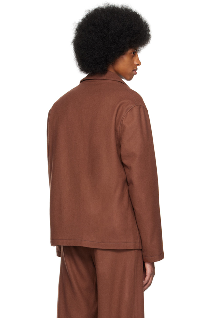 Merino wool melton jacket.

· Notched lapel
· Button closure
· Patch pockets at front
· Full plain-woven polyester-blend lining
· Contrast stitching in navy

Supplier color: Cappuccino