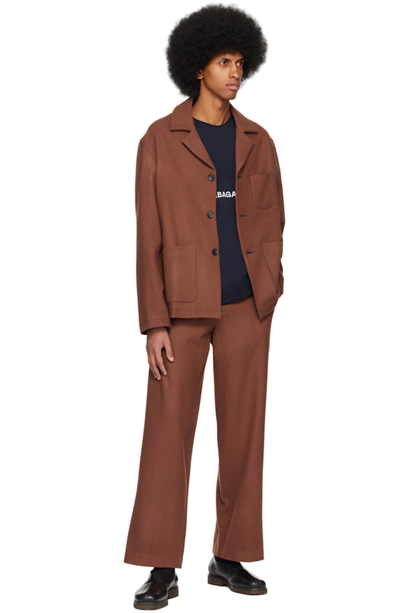 Merino wool melton jacket.

· Notched lapel
· Button closure
· Patch pockets at front
· Full plain-woven polyester-blend lining
· Contrast stitching in navy

Supplier color: Cappuccino
