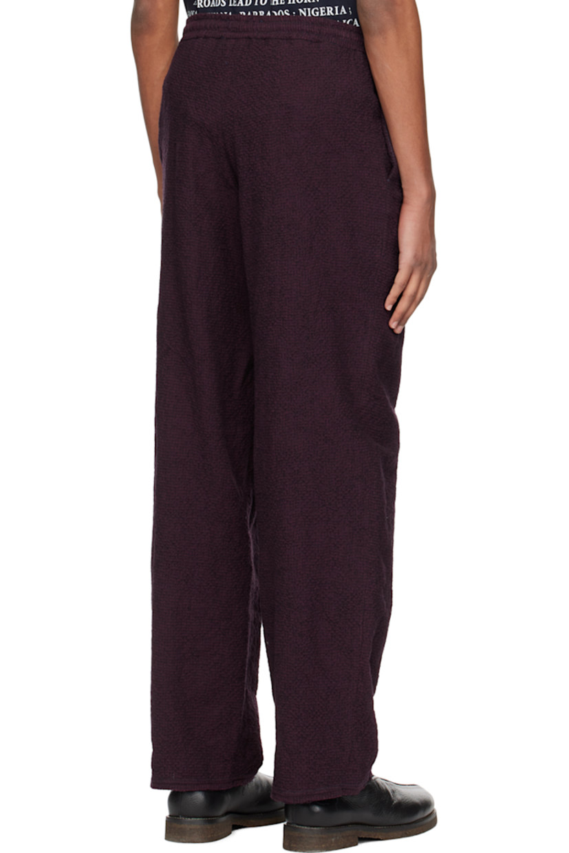 Cotton and wool-blend seersucker trousers.

· Drawstring at elasticized waistband
· Two-pocket styling
· Raw edge at cuffs

Supplier color: Burgundy