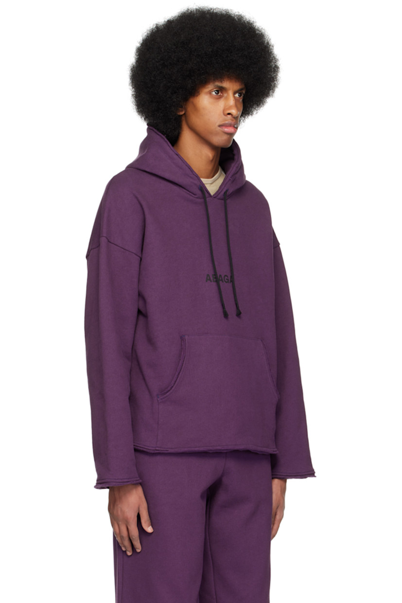 Organic cotton fleece hoodie. Raw edges throughout.

· Drawstring at hood
· Logo printed at front
· Kangaroo pocket
· Graphic printed at back

Supplier color: Purple/Black