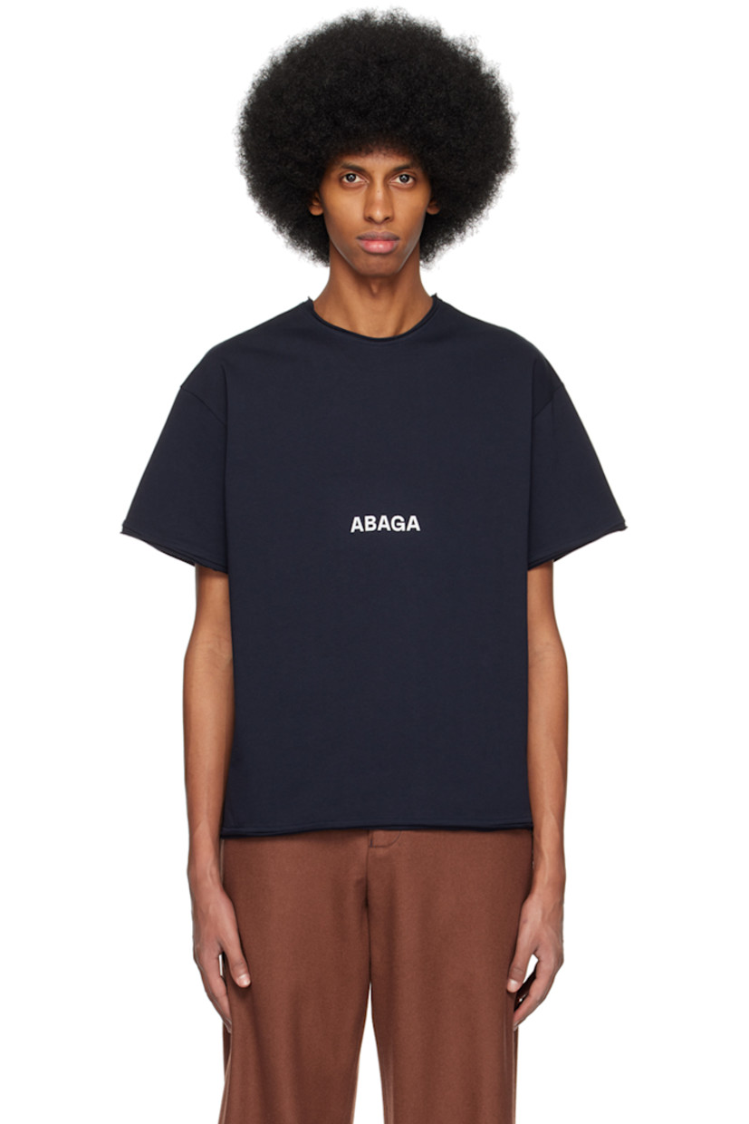 Organic cotton jersey T-shirt.

· Raw edge at crewneck, hem, and cuffs
· Logo printed at front
· Graphic and text printed at back

Supplier color: Black