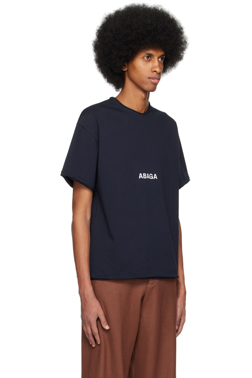 Organic cotton jersey T-shirt.

· Raw edge at crewneck, hem, and cuffs
· Logo printed at front
· Graphic and text printed at back

Supplier color: Black